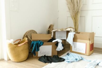 Cardboard boxes labeled 'Keep', 'Donate', and 'Trash' for home decluttering.